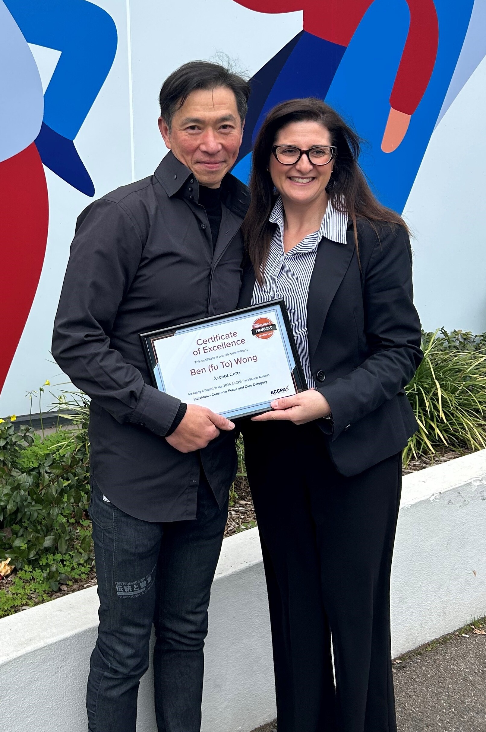 ACCPA SA State Manager Daniela Ciccarello presents Accept Care’s Ben (Fo To) Wong with his Excellence Awards certificate.
