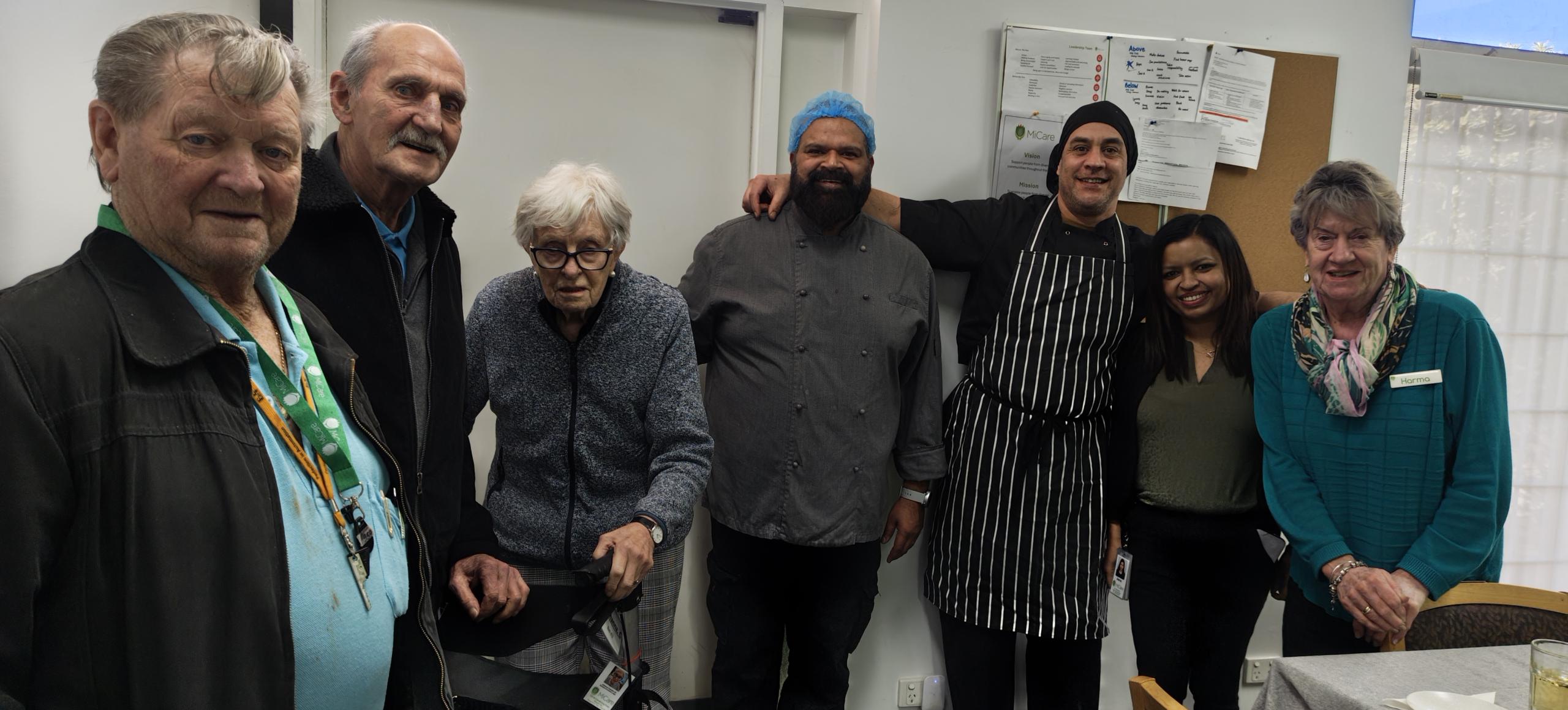 Residents touring the kitchen at MiCare