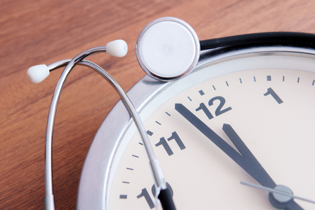 Medical Urgency Concept with Stethoscope and Clock